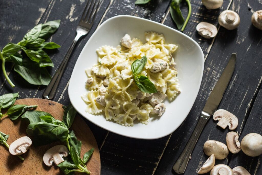 Creamy mushroom pasta on a plate seen from above with the plated dish centered