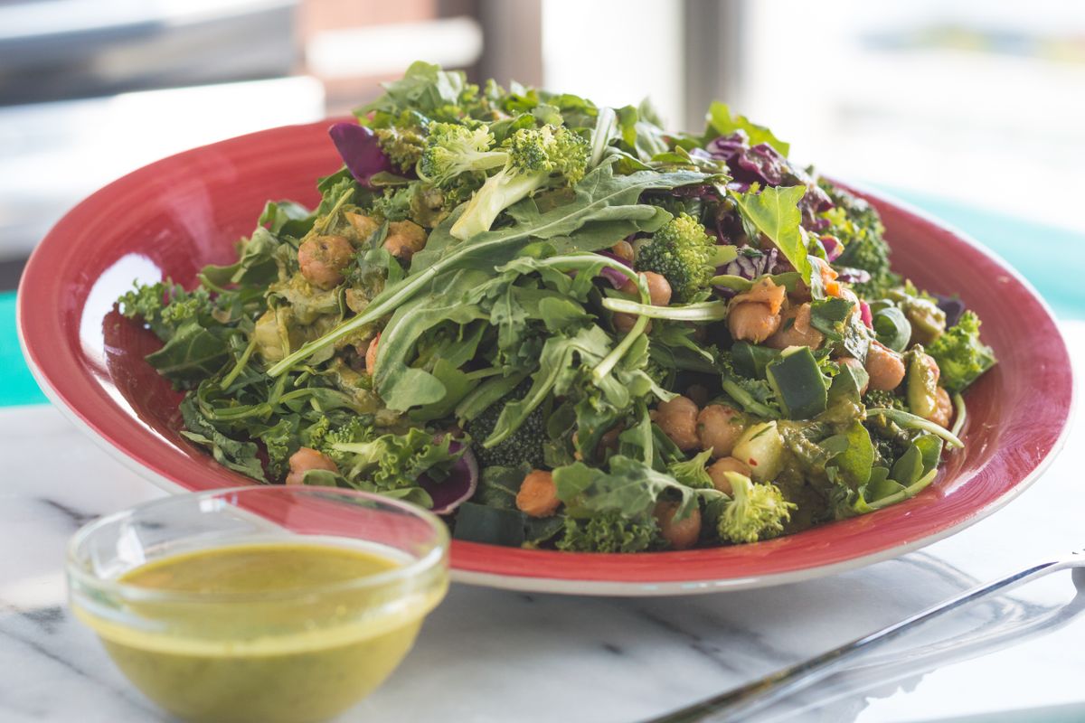 Mediterranean vegetable and chickpea salad served on a plate, photographed from above